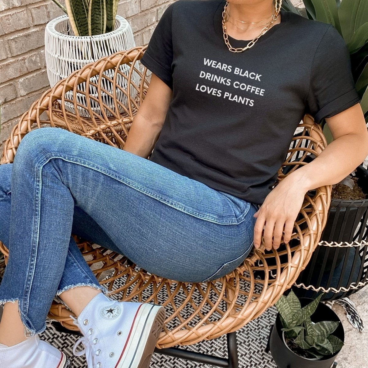 Wears Black. Drinks Coffee. Loves Plants. Short-Sleeve Unisex T-Shirt - Cotton Plus Cream