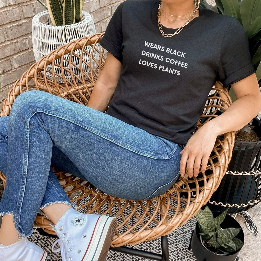Wears Black. Drinks Coffee. Loves Plants. Short-Sleeve Unisex T-Shirt - Cotton Plus Cream